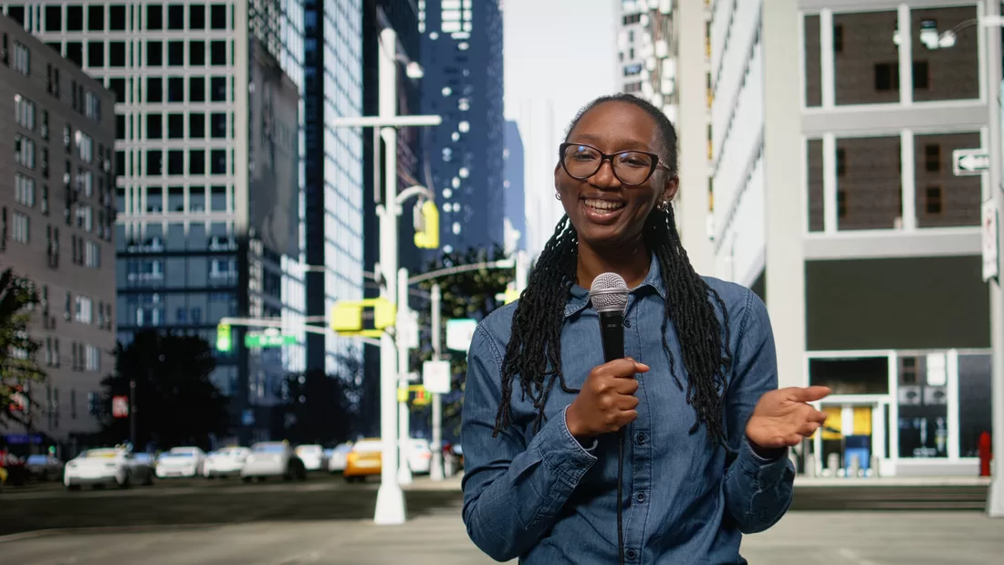 Reporter holding a microphone during a live street report